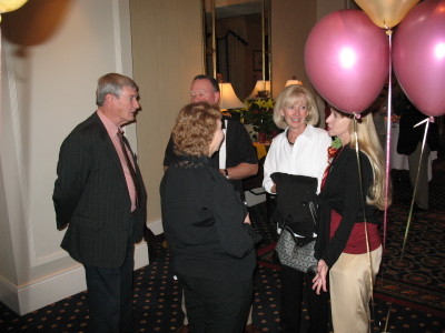 ? and ? chat with Donna Collins (near balloons) and Martha ?  facing Donna